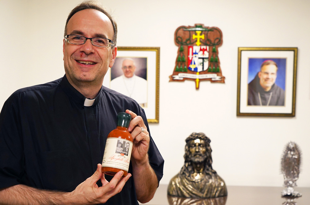 Priest uses mother's sauce recipe to help the needy, evangelize